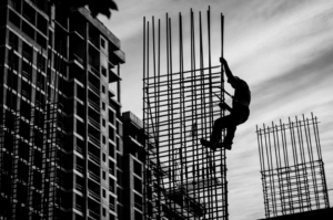 a worker climbing a structure